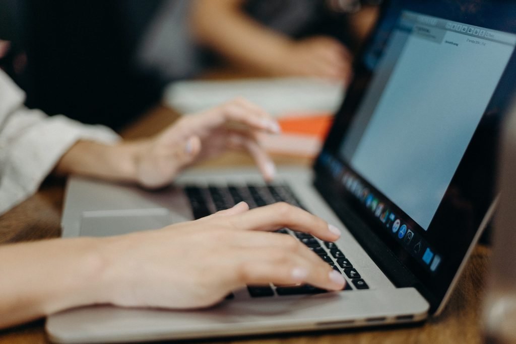 Person writing content into their word processor