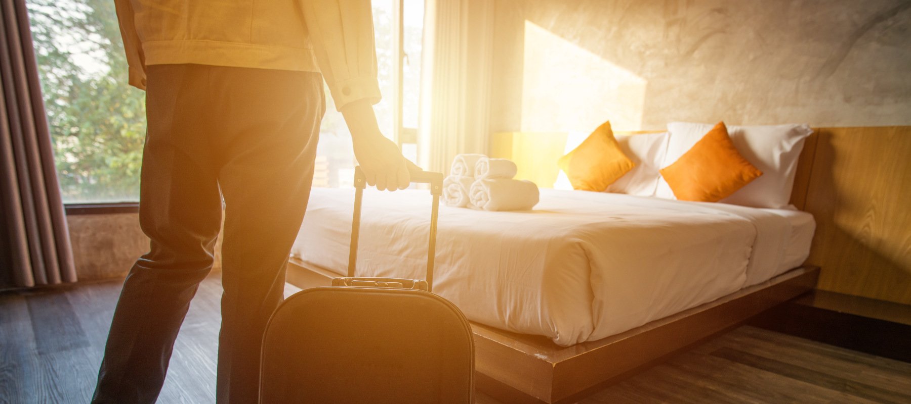 man checking into glamping accommodation