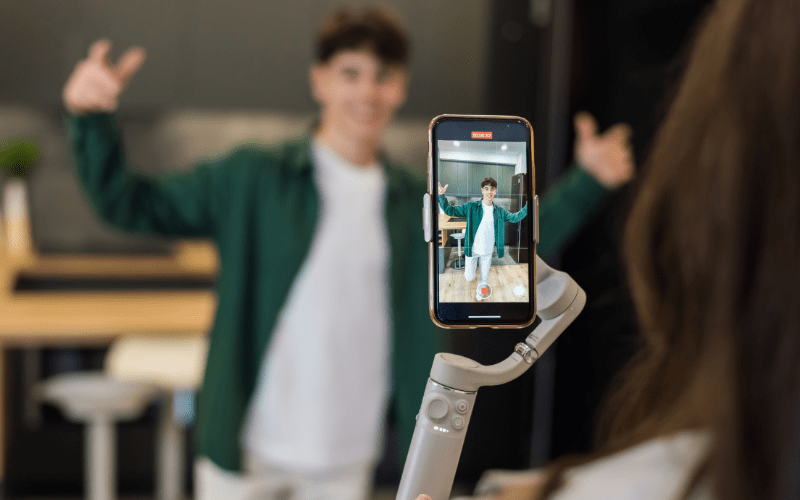 A TikTok marketing expert recording a video on their phone