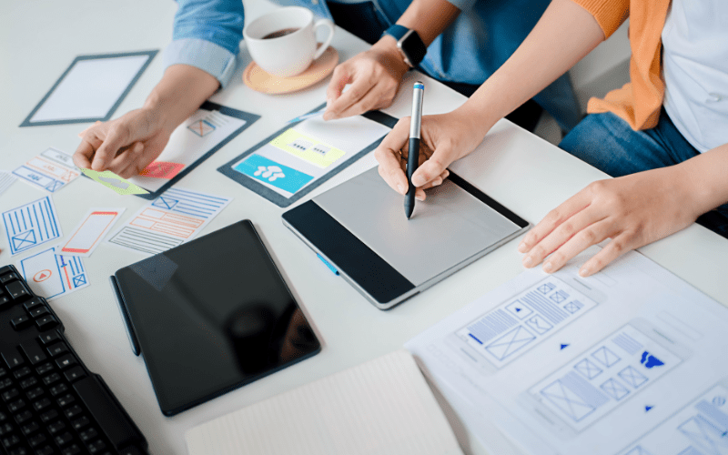 Two content marketers planning out their content marketing strategy