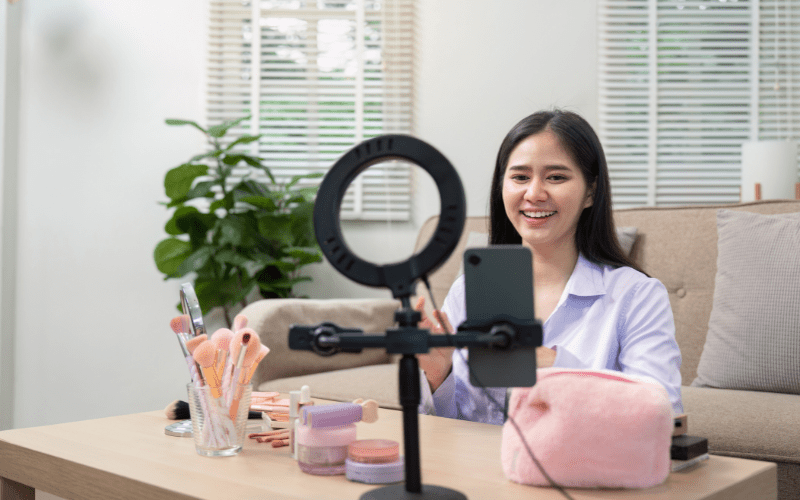 A woman recording a makeup themed influencer marketing video